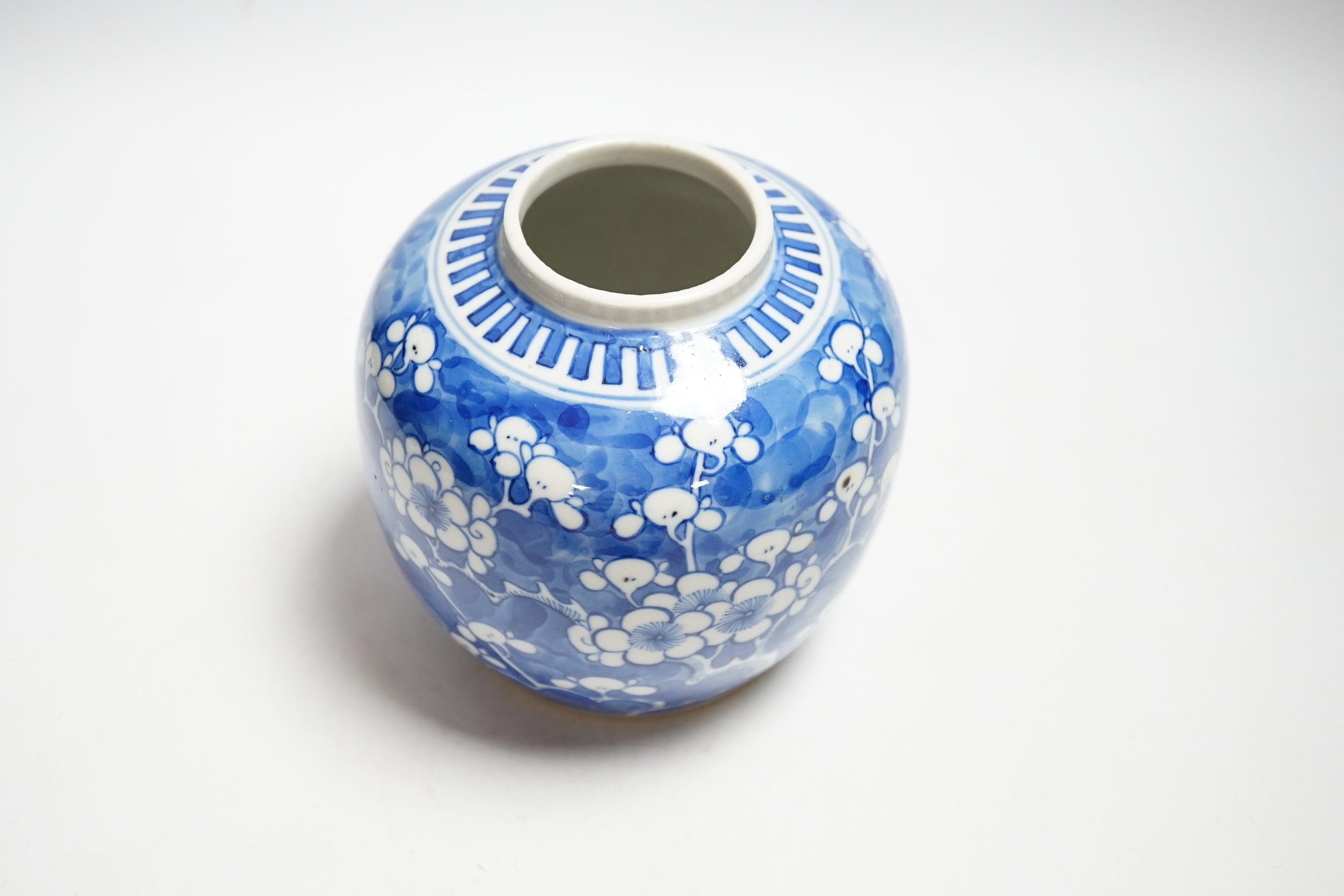 An early 20th century Chinese blue and white prunus jar and cover, 14cm